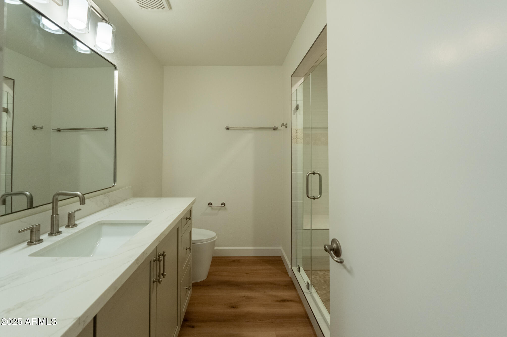 10115 East Mountain View Road, Unit 1089 Scottsdale, AZ 85258 - Photo 13 of 28 a bathroom with a sink a toilet and shower