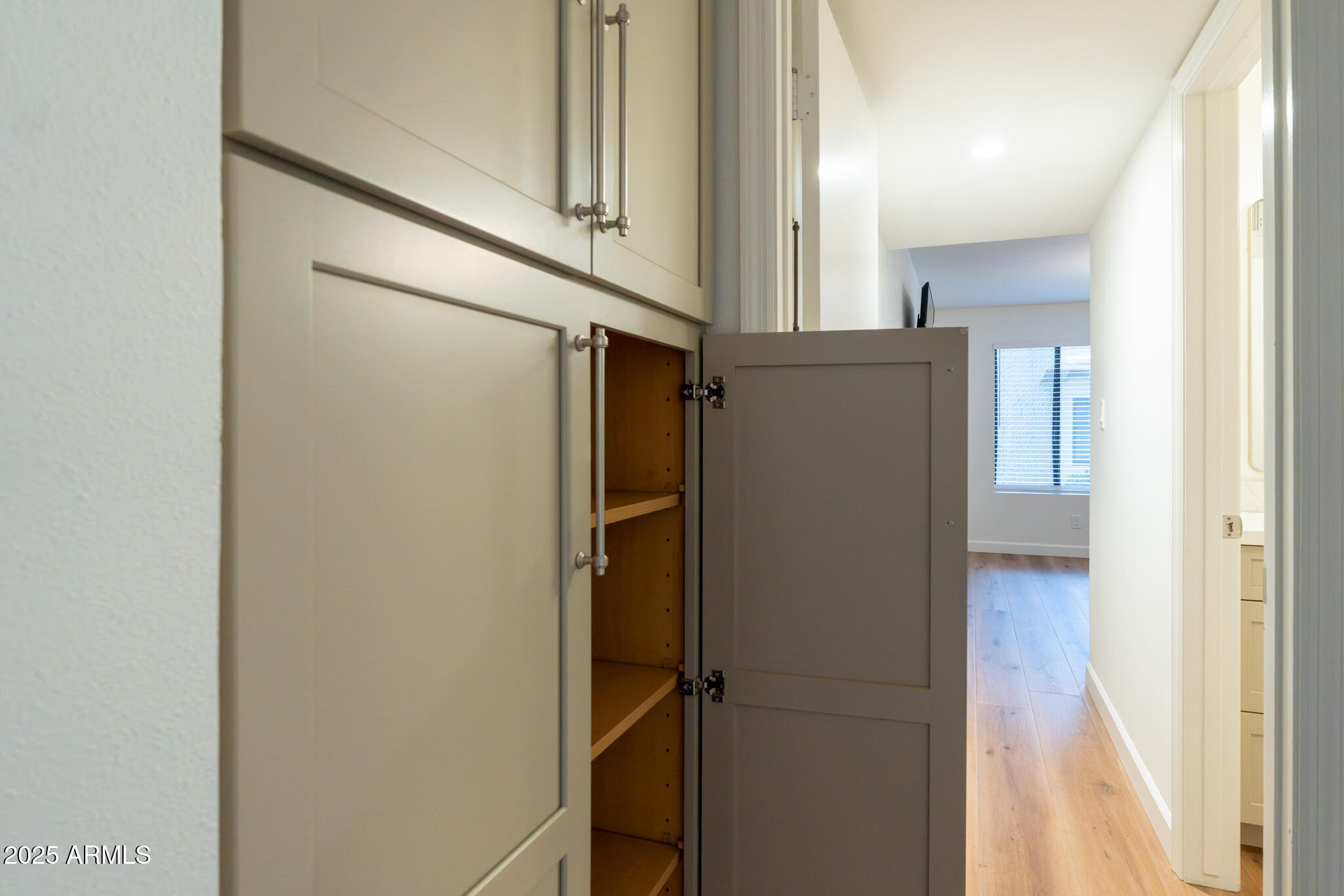 10115 East Mountain View Road, Unit 1089 Scottsdale, AZ 85258 - Photo 15 of 28 a view of a refrigerator in kitchen and an empty room