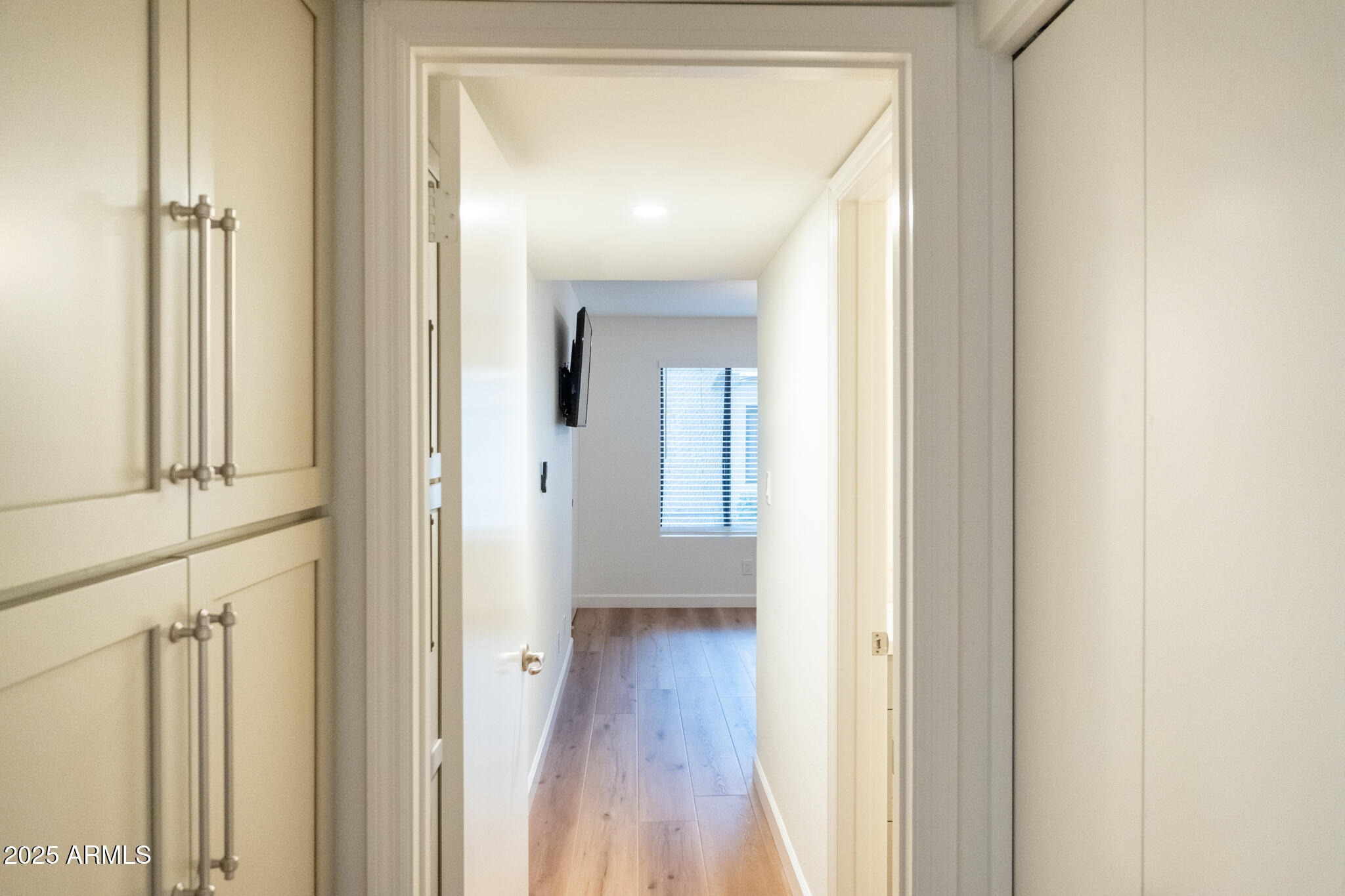 10115 East Mountain View Road, Unit 1089 Scottsdale, AZ 85258 - Photo 16 of 28 a view of a hallway with wooden floor