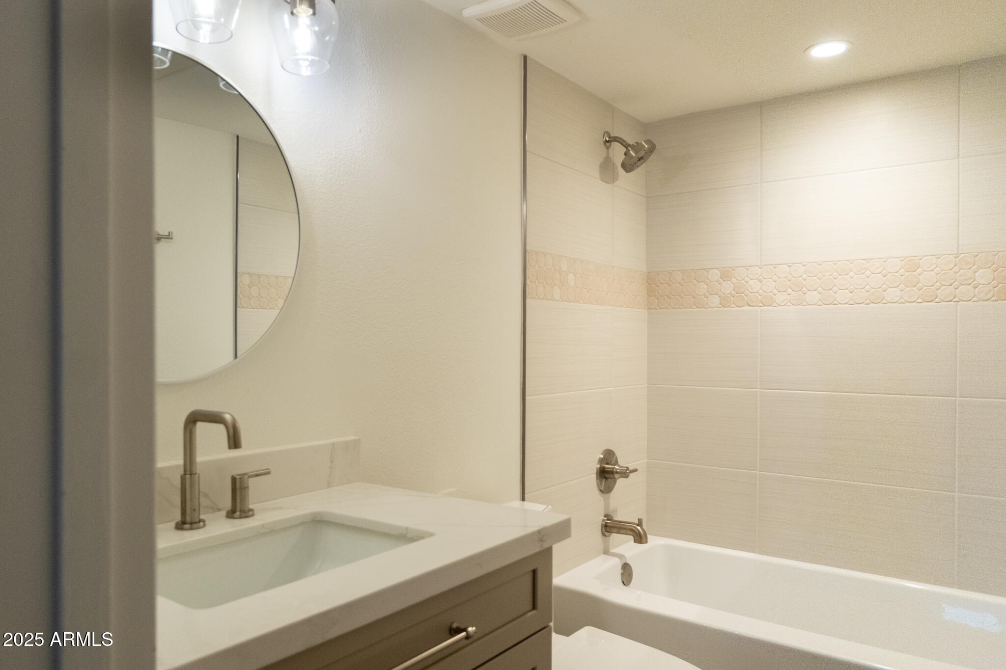 10115 East Mountain View Road, Unit 1089 Scottsdale, AZ 85258 - Photo 20 of 28 a bathroom with a sink and a mirror