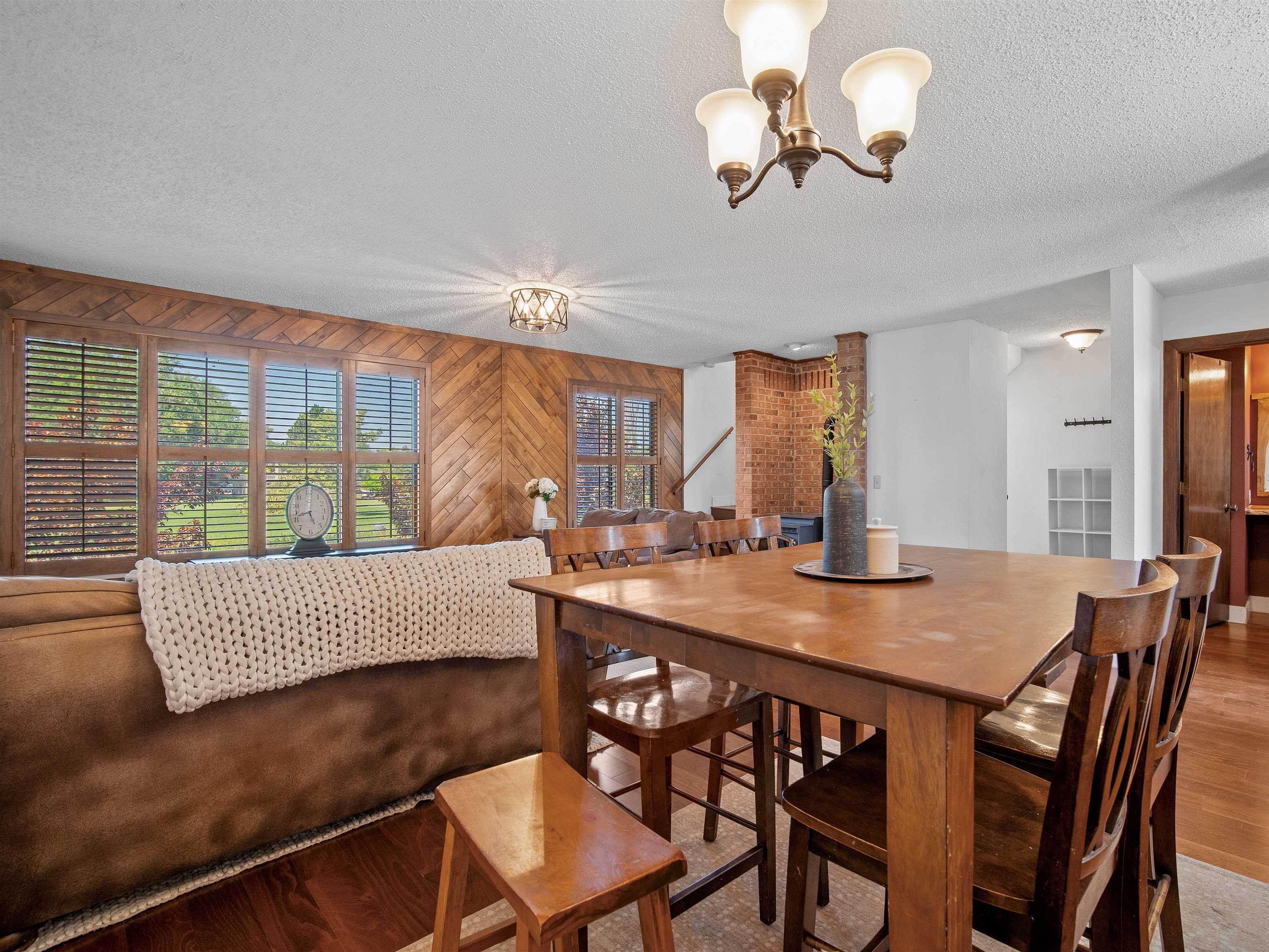 517 Rado Drive, Unit D Grand Junction, CO 81507 - Photo 8 of 24 a view of a dining room with furniture wooden floor and chandelier