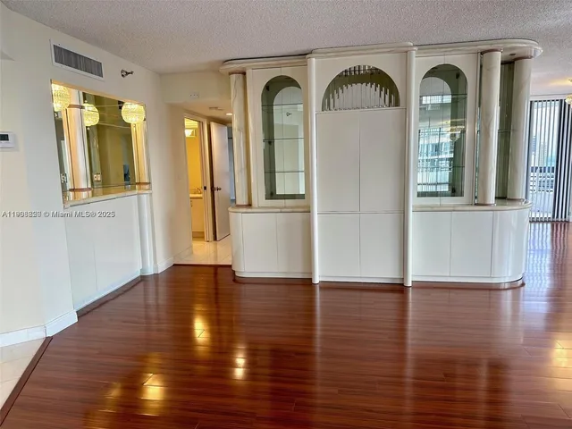 a kitchen with stainless steel appliances a refrigerator stove and microwave