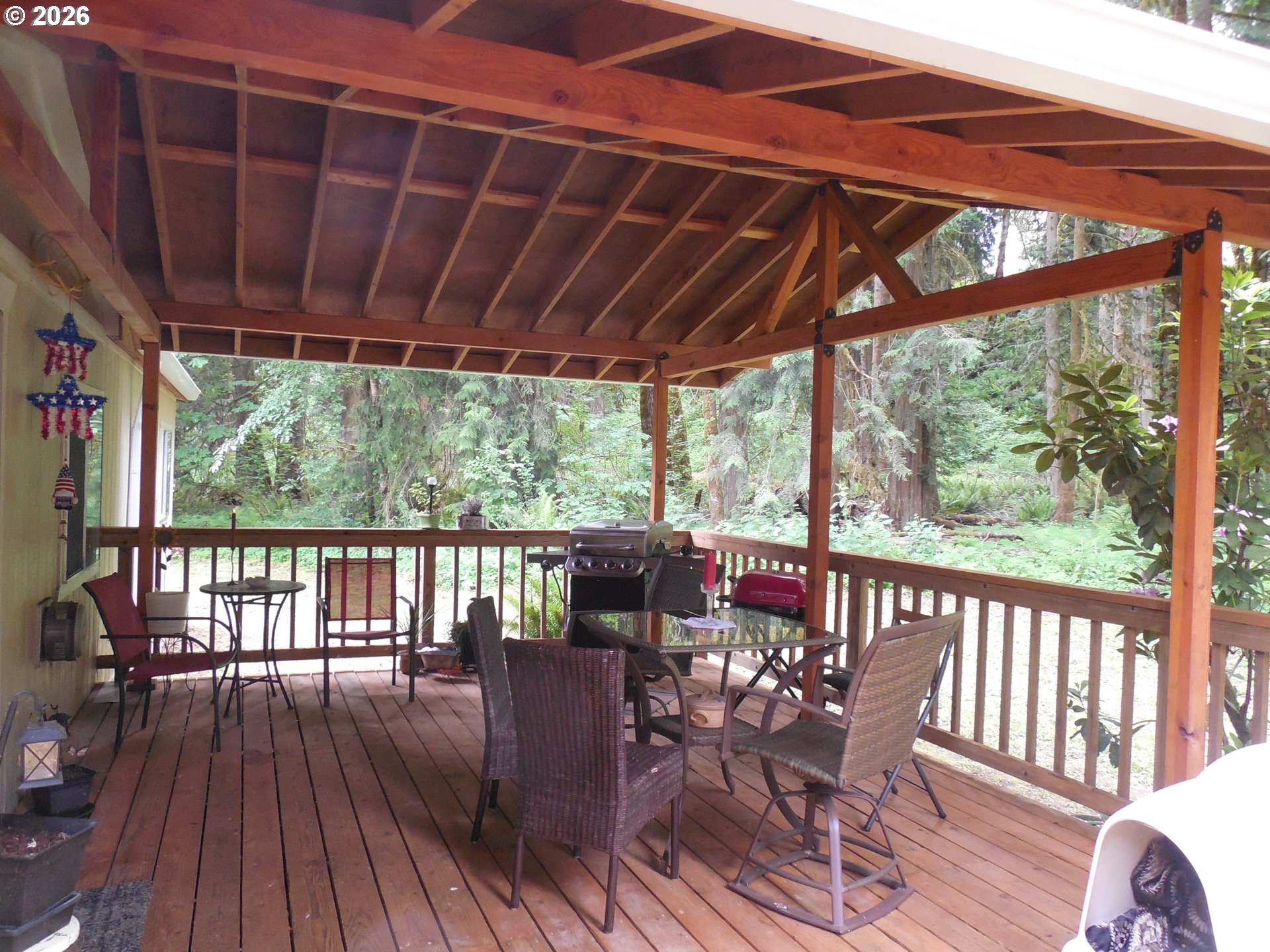41180 Southeast Kubitz Road Sandy, OR 97055 - Photo 33 of 35 a view of porch with a table and a chairs