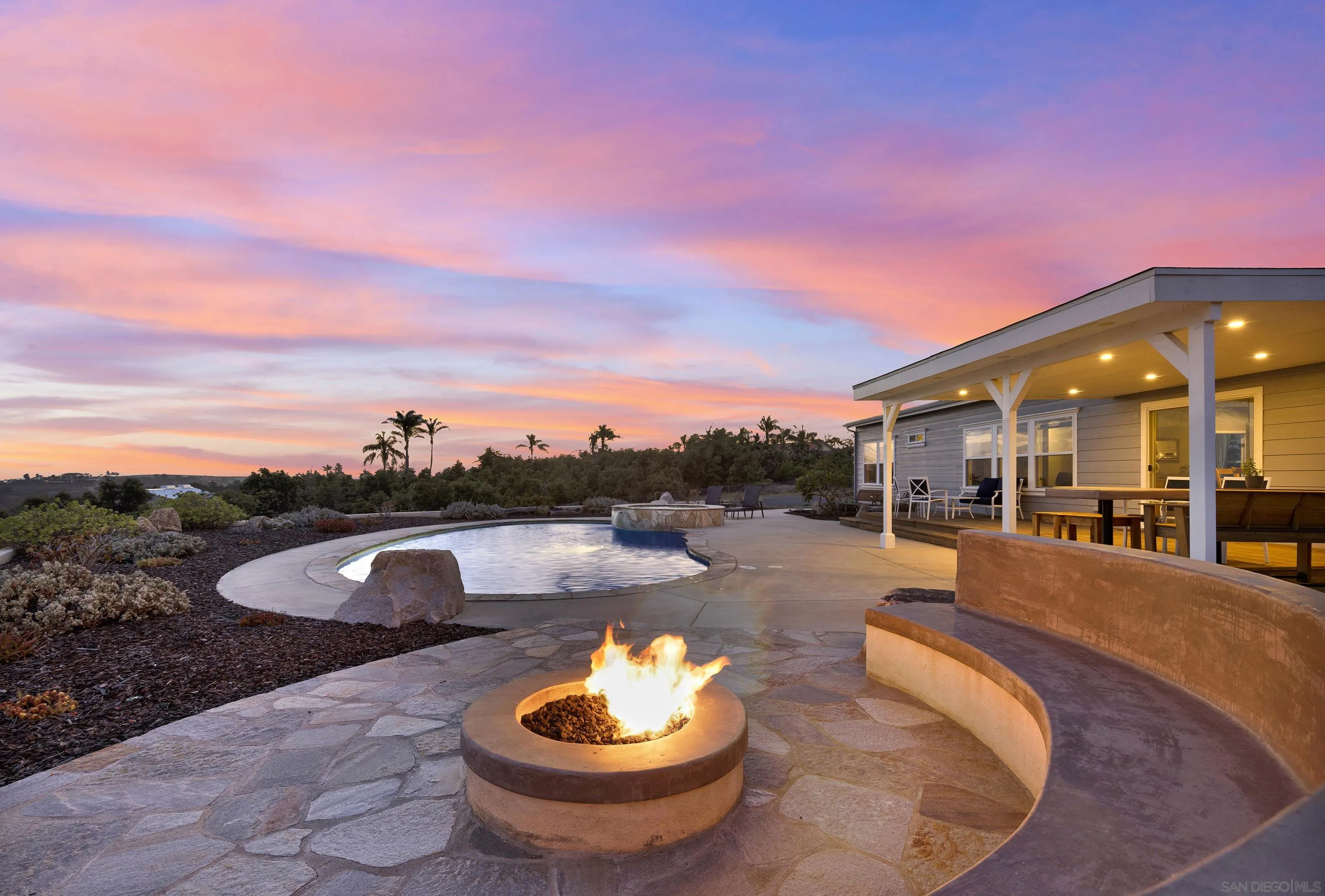 8036 West Lilac Road Bonsall, CA 92003 - Photo 54 of 72 a view of a swimming pool with a patio