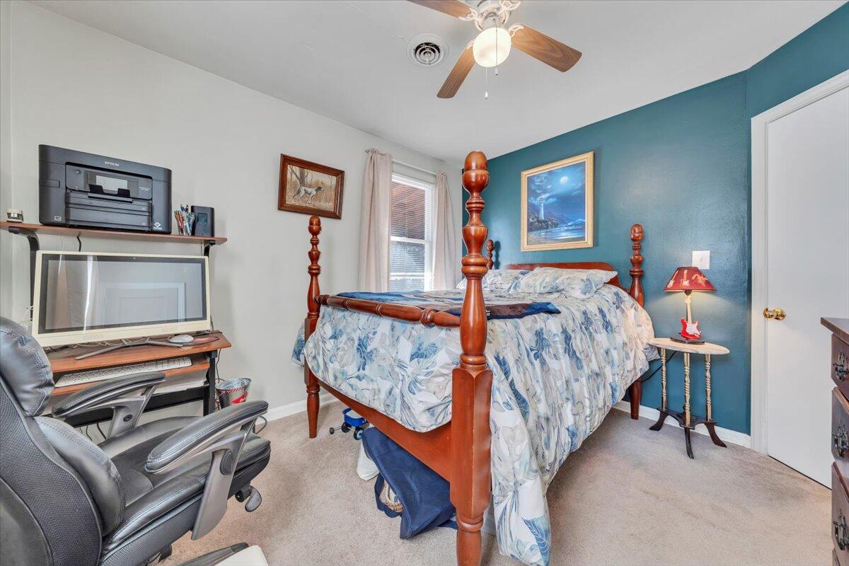 4820 Rutgers Street Northwest Roanoke, VA 24012 - Photo 19 of 41 a bedroom with furniture and a flat screen tv