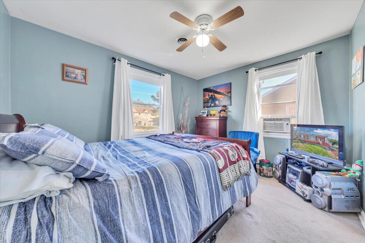 4820 Rutgers Street Northwest Roanoke, VA 24012 - Photo 20 of 41 a bedroom with a bed and a flat screen tv