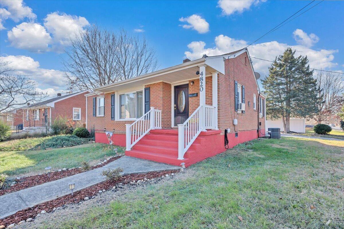 4820 Rutgers Street Northwest Roanoke, VA 24012 - Photo 2 of 41 a front view of a house with yard and staircase