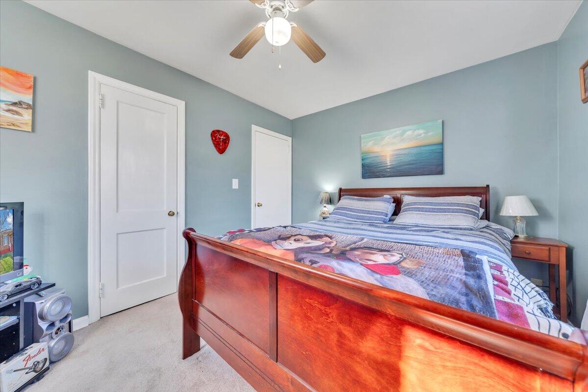 4820 Rutgers Street Northwest Roanoke, VA 24012 - Photo 21 of 41 a bedroom with a bed and a chandelier