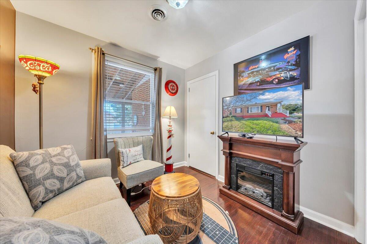 4820 Rutgers Street Northwest Roanoke, VA 24012 - Photo 23 of 41 a living room with furniture and a fireplace