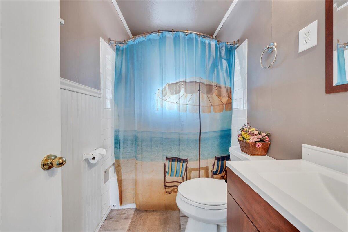 4820 Rutgers Street Northwest Roanoke, VA 24012 - Photo 25 of 41 a bathroom with a sink mirror vanity and toilet