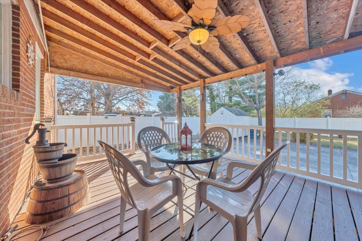 4820 Rutgers Street Northwest Roanoke, VA 24012 - Photo 26 of 41 a view of a balcony with furniture and wooden floor