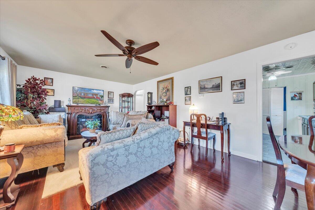 4820 Rutgers Street Northwest Roanoke, VA 24012 - Photo 3 of 41 a living room with fireplace furniture and a wooden floor