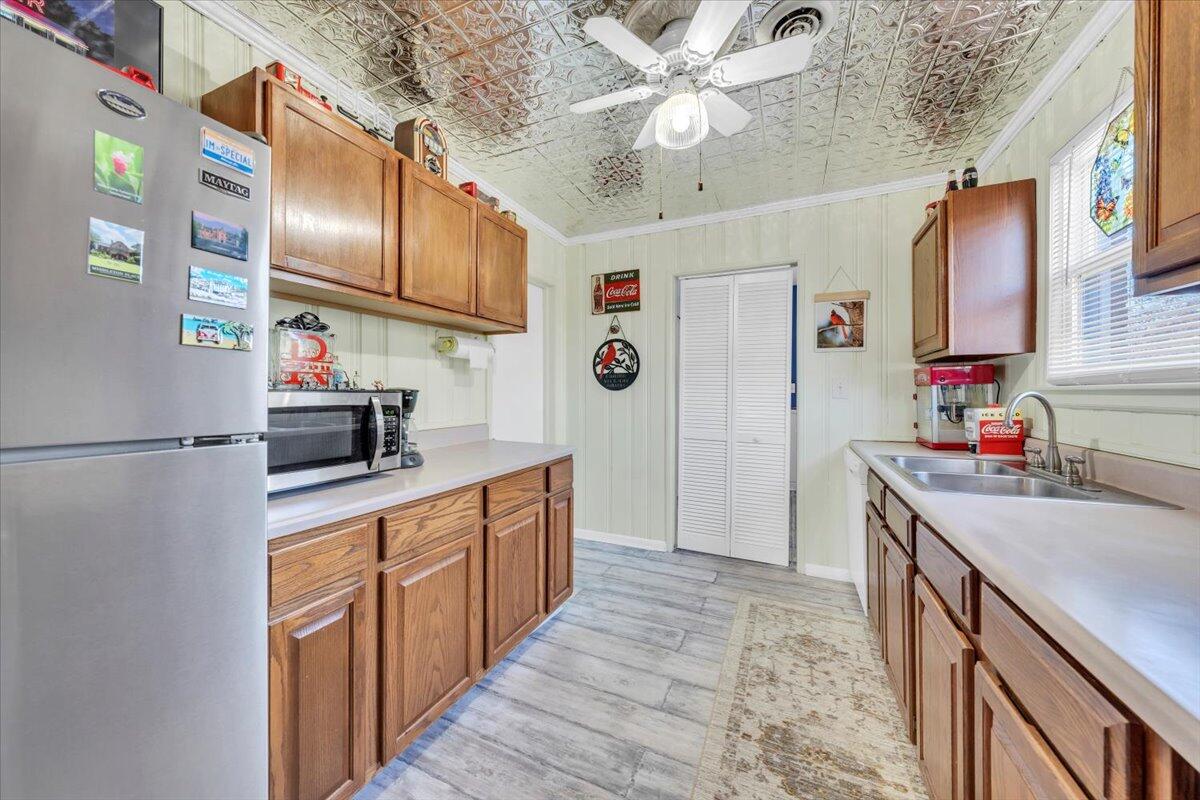 4820 Rutgers Street Northwest Roanoke, VA 24012 - Photo 10 of 41 a kitchen with stainless steel appliances granite countertop a sink refrigerator and cabinets