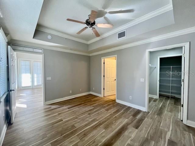 720 Celebration Avenue, Unit 235 Celebration, FL 34747 - Photo 10 of 16 a view of livingroom with hardwood floor and a ceiling fan