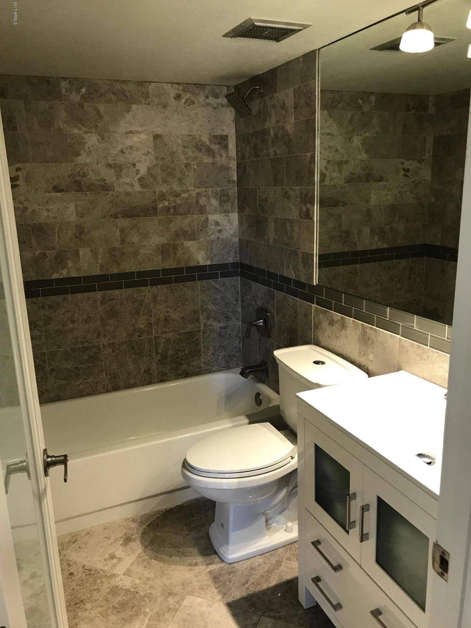 154 West 5th Street, Unit 248 Tempe, AZ 85281 - Photo 12 of 18 a bathroom with a toilet and a shower