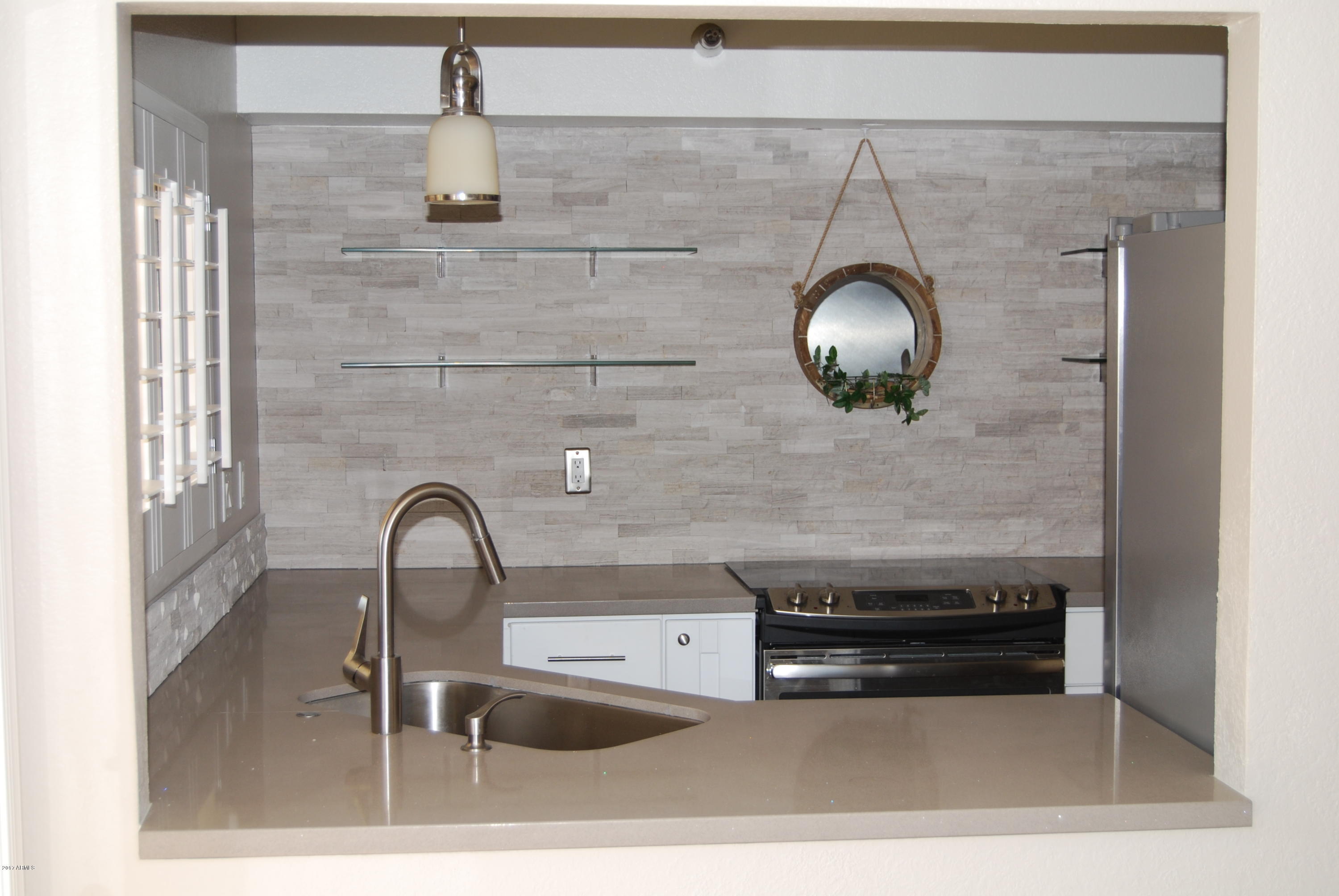 154 West 5th Street, Unit 248 Tempe, AZ 85281 - Photo 3 of 18 a bathroom with a sink and mirror