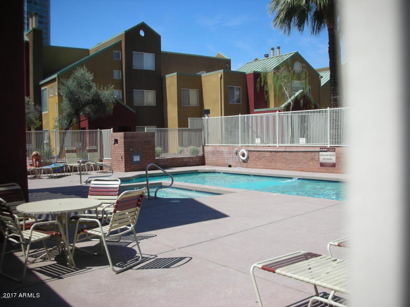 154 West 5th Street, Unit 248 Tempe, AZ 85281 - Photo 8 of 18 front view of house with a chairs and table in the patio