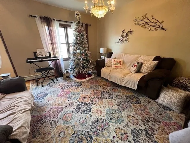 a bedroom with a bed and a chandelier