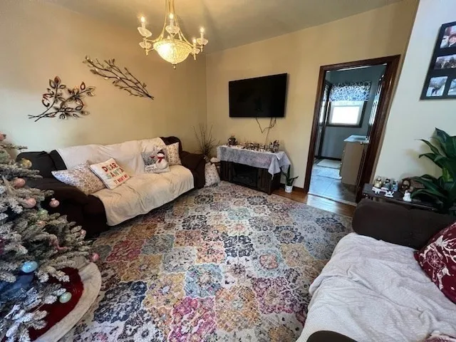 a spacious bedroom with a bed and a flat screen tv