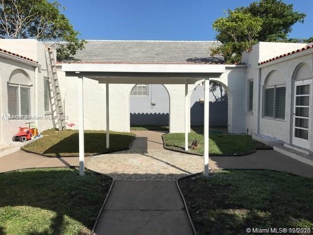 Normandy Beach Surfside, FL 33154 - Photo 2 of 2 a view of a house with backyard and porch