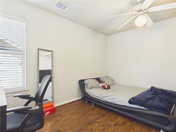 a bedroom with a bed and cabinets
