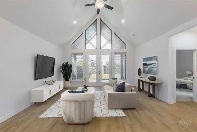 a living room with furniture and a flat screen tv
