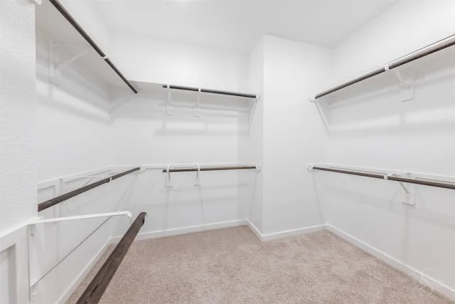a view of an empty walk in closet