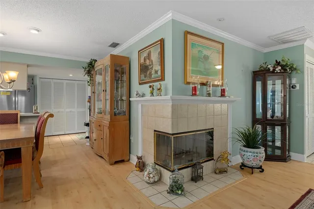 a living room with furniture a fireplace and a table