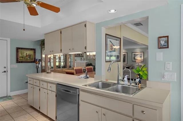a kitchen with a sink and cabinets