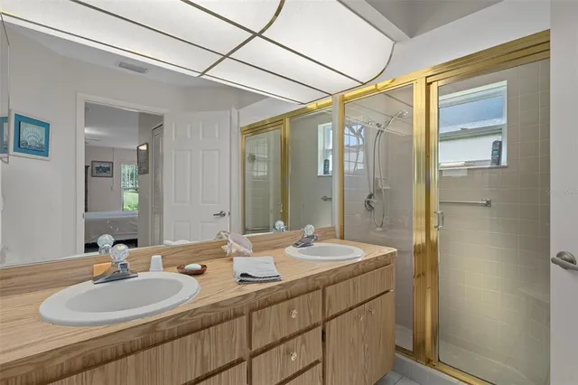 a bathroom with a double vanity sink mirror and double