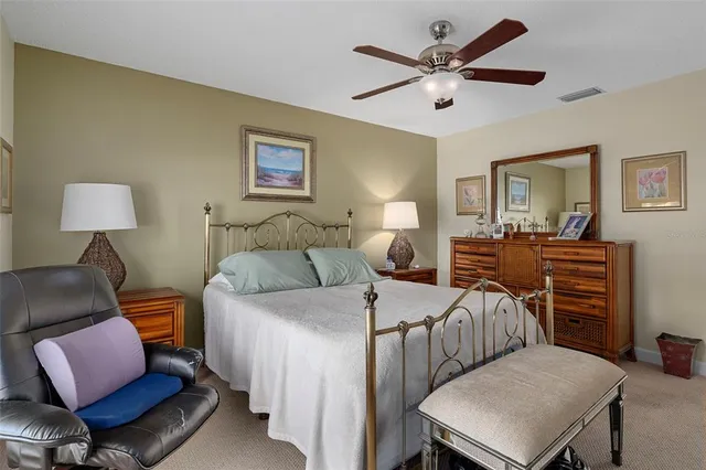 a bedroom with a bed and a chair