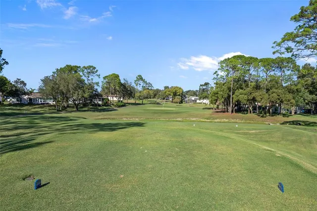 a view of a golf course with a trees