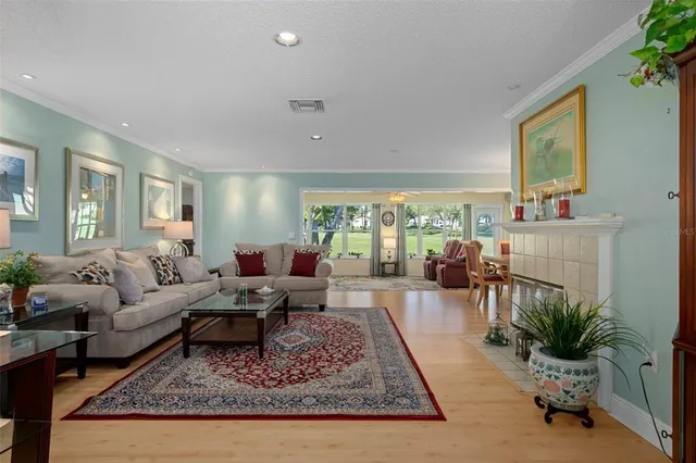 a living room with furniture or couch and a large window