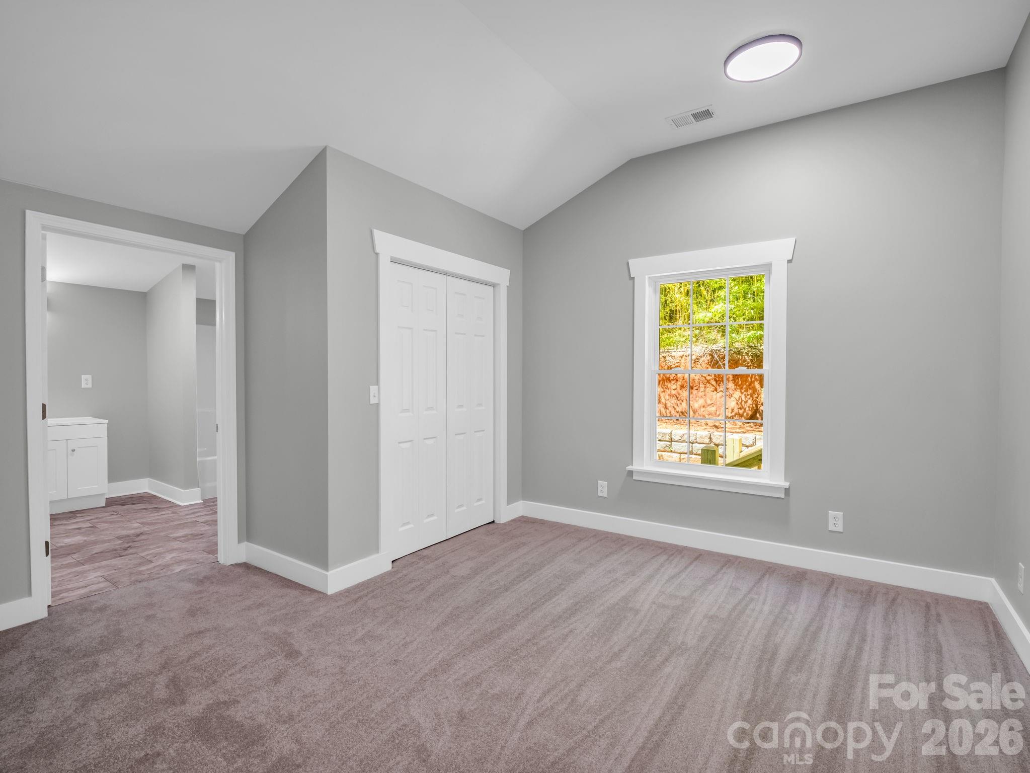 5923 Highway 14 Landrum, SC 29356 - Photo 8 of 15 an empty room with a window and a bathroom