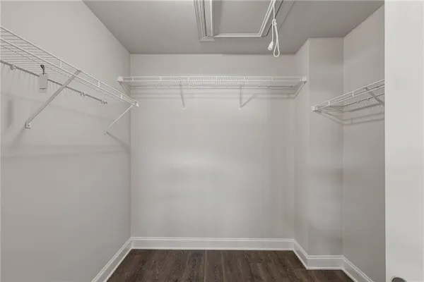 a empty walk in closet with white walls