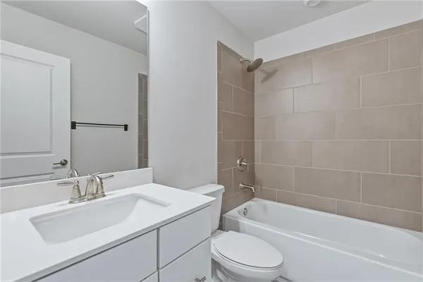 a bathroom with a sink toilet and bathtub