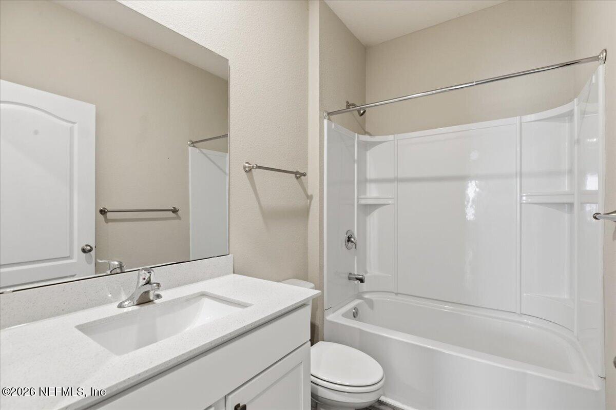 51 Tree Frog Way St. Augustine, FL 32095 - Photo 15 of 21 a bathroom with a sink toilet and shower