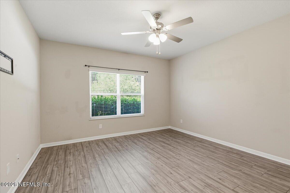 51 Tree Frog Way St. Augustine, FL 32095 - Photo 10 of 21 wooden floor in an empty room with a window
