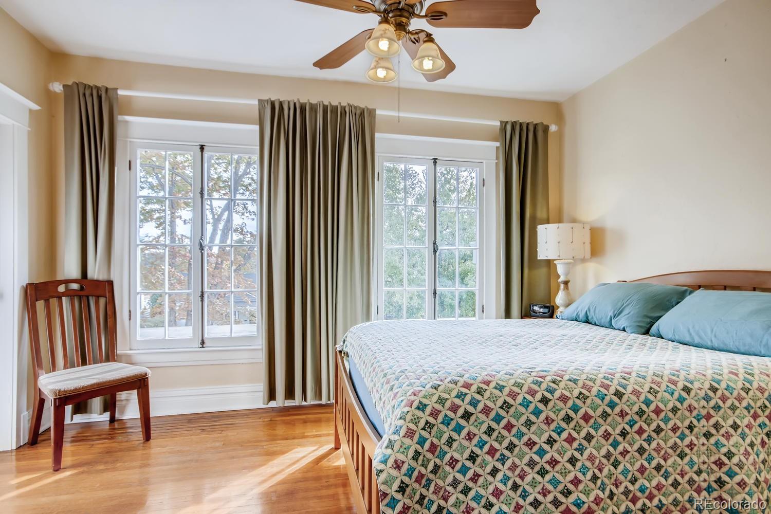 3345 Raleigh Street Denver, CO 80212 - Photo 16 of 27 a bedroom with a bed and a large window