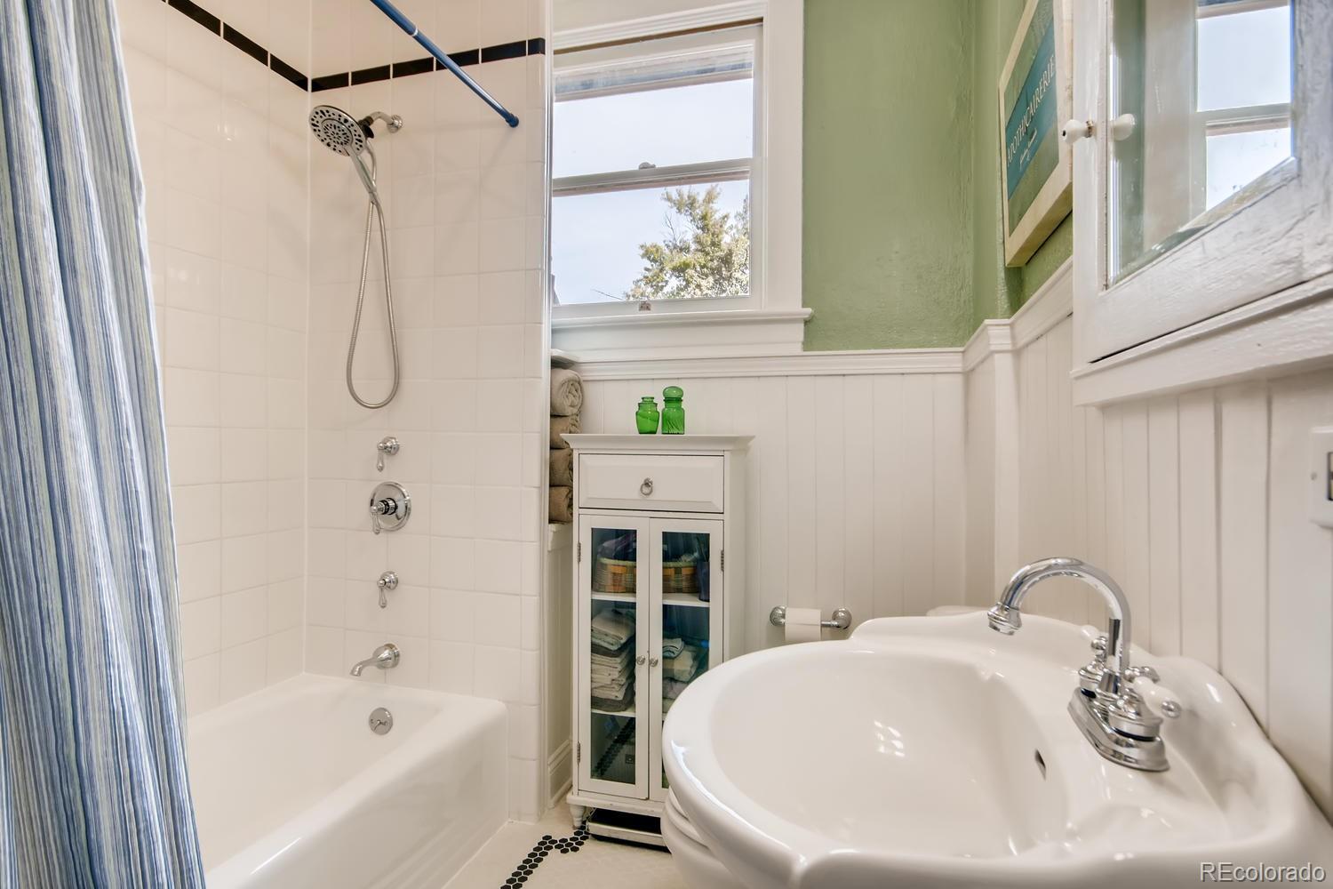 3345 Raleigh Street Denver, CO 80212 - Photo 19 of 27 a bathroom with a sink and a bathtub