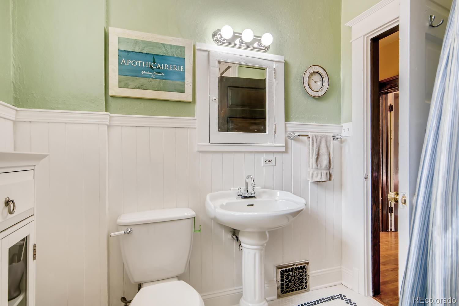 3345 Raleigh Street Denver, CO 80212 - Photo 20 of 27 a bathroom with a sink and a mirror