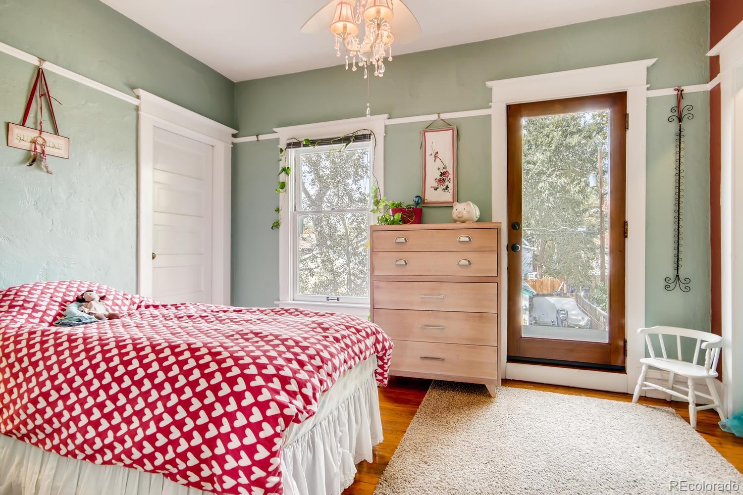3345 Raleigh Street Denver, CO 80212 - Photo 22 of 27 a bedroom with a bed and window