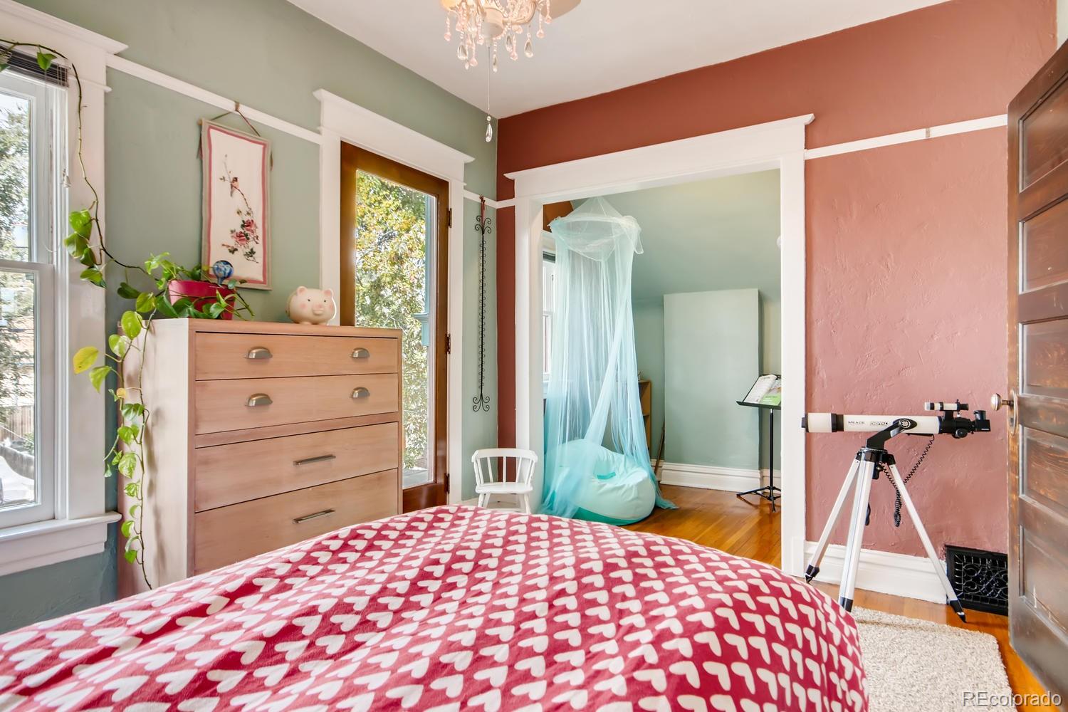 3345 Raleigh Street Denver, CO 80212 - Photo 23 of 27 a bedroom with a bed and a dresser