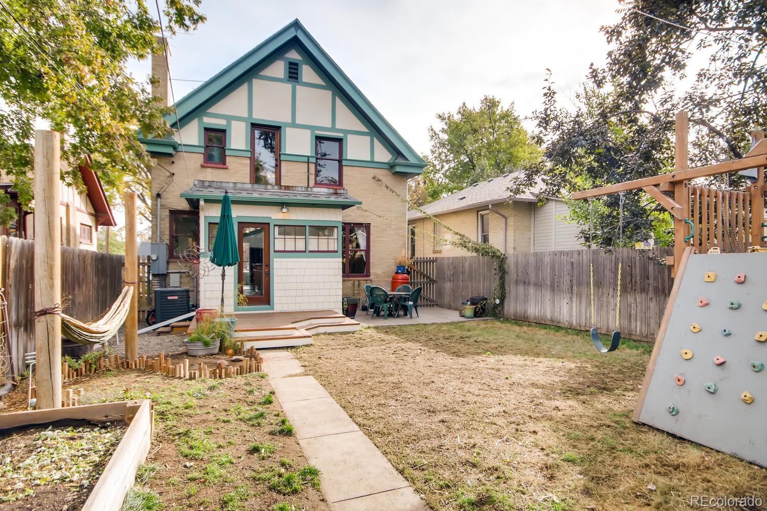 3345 Raleigh Street Denver, CO 80212 - Photo 27 of 27 a front view of a house with garden
