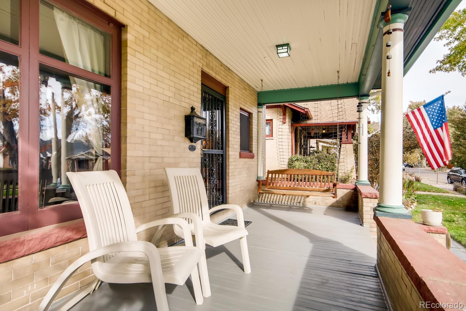 3345 Raleigh Street Denver, CO 80212 - Photo 5 of 27 a living room with furniture and a large window