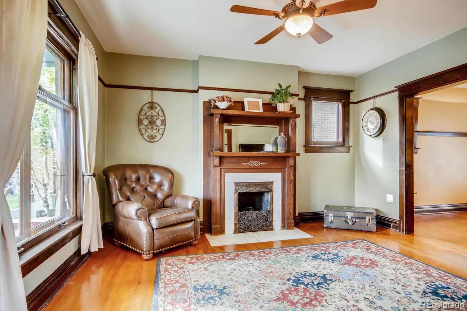 3345 Raleigh Street Denver, CO 80212 - Photo 6 of 27 a living room with furniture and a fireplace