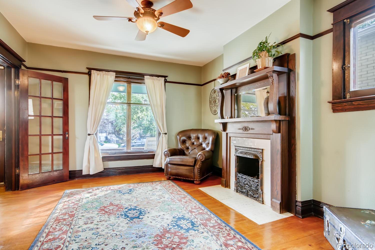 3345 Raleigh Street Denver, CO 80212 - Photo 7 of 27 a bedroom with furniture and a fireplace