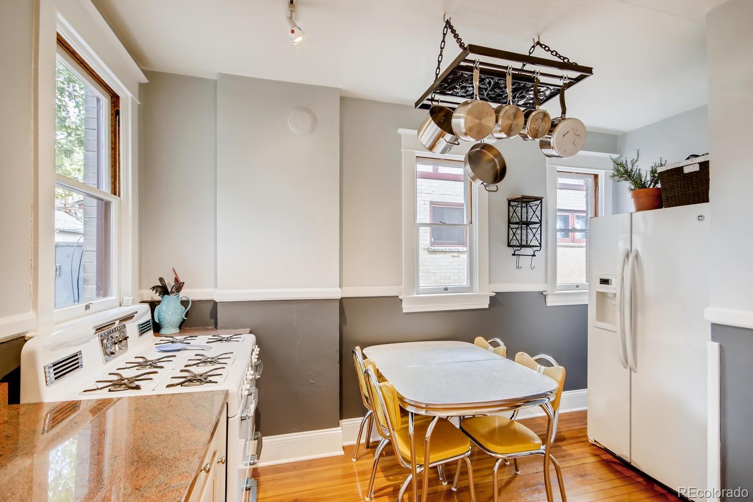 3345 Raleigh Street Denver, CO 80212 - Photo 9 of 27 a dining room with a table chairs and a dining table