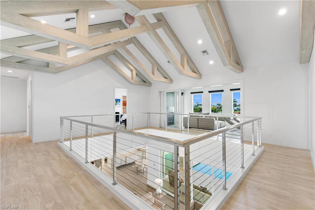 549 Hernando Drive Marco Island, FL 34145 - Photo 19 of 34 a kitchen with stainless steel appliances kitchen island granite countertop a sink and cabinets