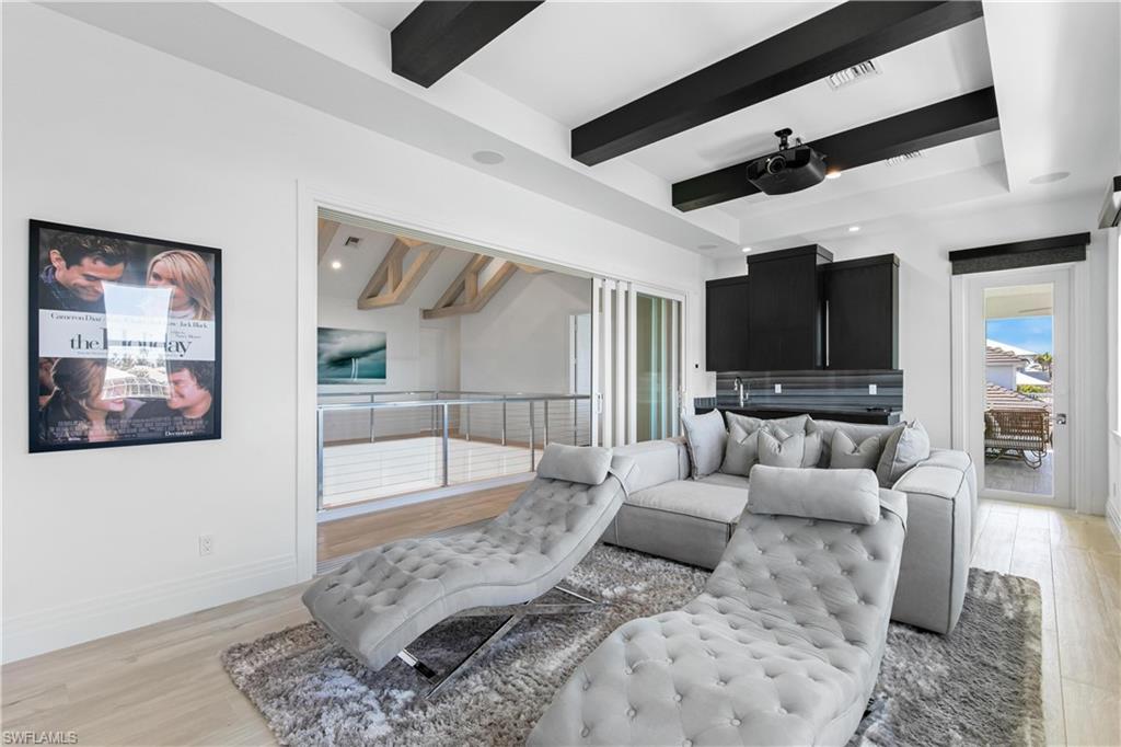 549 Hernando Drive Marco Island, FL 34145 - Photo 20 of 34 a living room with furniture and a flat screen tv